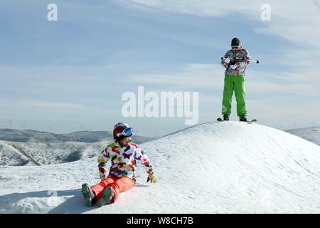 Tourists enjoy skiing at a ski resort in Zigui County, Yichang City ...