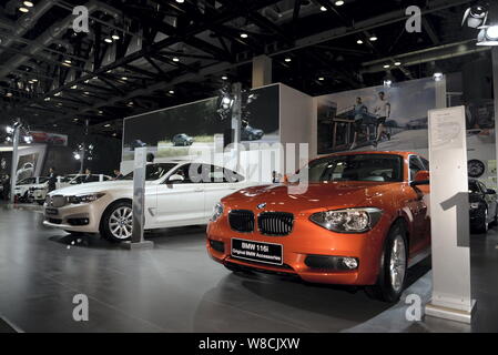 gevechten maniac Aanpassing --FILE--A BMW 116i and other BMW cars are displayed during an auto show in  Beijing, China, 12 December 2014. BMW opened an online shop on Alibaba'  Stock Photo - Alamy