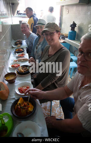 Tourists Eating at Small Eatery in the Medina, Morocco Stock Photo