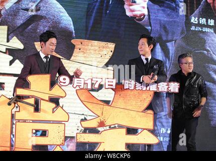 (From left) South Korean actors Ha Jung-woo, Lee Jung-jae and director Choi Dong-hoon attend a press conference for their new movie 'Assassination' in Stock Photo