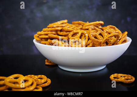 Salted pretzel on dark background Stock Photo