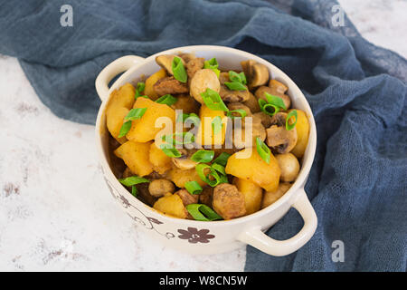Stewed potatoes on white background Stock Photo