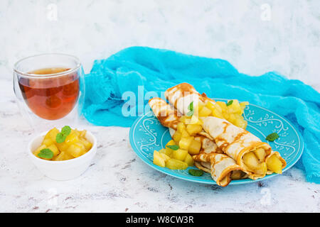 Pancakes with apples on white background Stock Photo