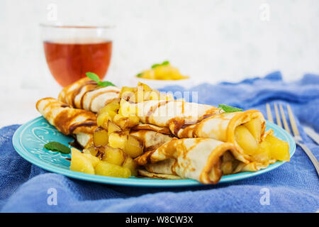 Pancakes with apples on white background Stock Photo