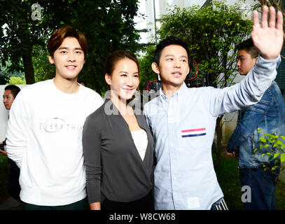 (From left) Chinese actor Li Yifeng, Taiwanese-American singer Coco Lee and Chinese director He Jiong pose at the shooting scene of their new movie in Stock Photo