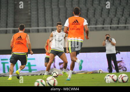 Cristiano Ronaldo, center, and teammates of Real Madrid take part in a training session in Shanghai, China, 29 July 2015. Stock Photo