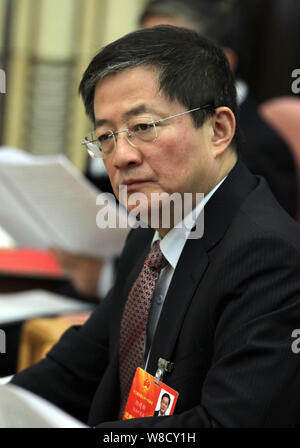 --FILE--Ren Jianxin, chairman of China National Chemical Corporation (ChemChina), attends a meeting during the first session of the 12th National Peop Stock Photo