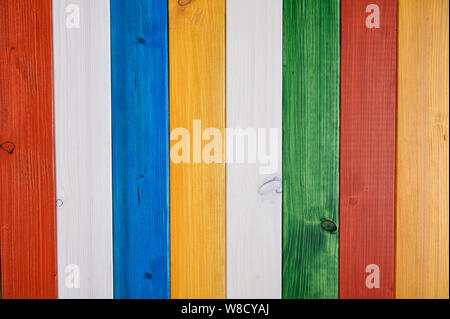 Colorful background of white, blue, red, yellow, and green colored wooden planks. Stock Photo