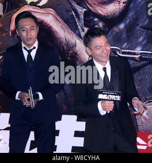 Hong Kong actor Andy Lau, right, and Chinese actor Liu Ye attend the premiere for their new movie 'Saving Mr. Wu' in Beijing, China, 21 September 2015 Stock Photo
