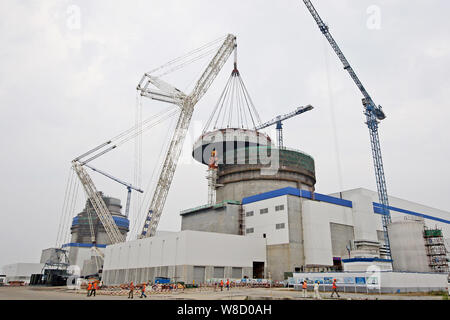 A Containment Dome For The No.2 Reactor Is Being Lifted And Installed ...