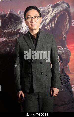 Chinese director Lu Chuan poses on the red carpet for the premiere of his movie 'Chronicles of the Ghostly Tribe' in Beijing, China, 24 September 2015 Stock Photo