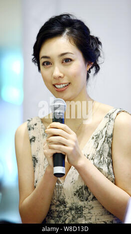 --FILE--Japanese actress Kazue Fukiishi speaks at a press conference for the opening of the Japanese Film Week during the 14th Shanghai International Stock Photo