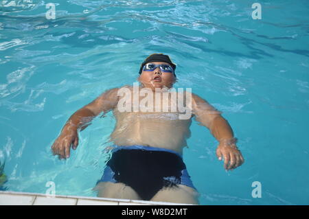 Obese Fat Boy In Swimming Pool, Concept Healthy And Exercise Stock 