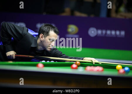 Tom Ford of England plays a shot to Judd Trump of England in their quarterfinal match during the 2019 World Snooker International Championship in Daqing city, northeast China's Heilongjiang province, 8 August 2019. Stock Photo