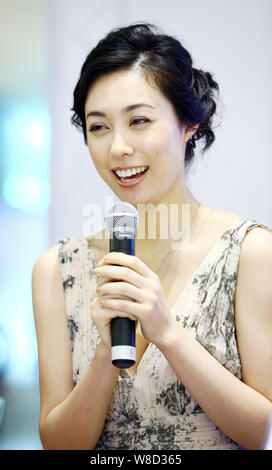 --FILE--Japanese actress Kazue Fukiishi speaks at a press conference for the opening of the Japanese Film Week during the 14th Shanghai International Stock Photo