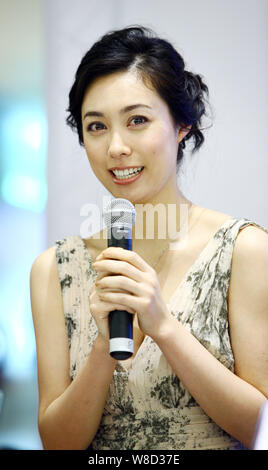 --FILE--Japanese actress Kazue Fukiishi speaks at a press conference for the opening of the Japanese Film Week during the 14th Shanghai International Stock Photo