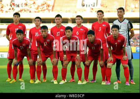 Players of the starting line-up of North Korea pose before their soccer match of the Men's East Asian Cup 2015 against Japan in Wuhan city, central Ch Stock Photo