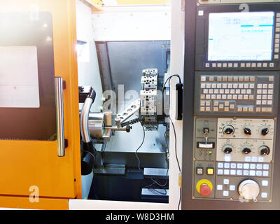 Compact modern lathe with CNC control panel Stock Photo