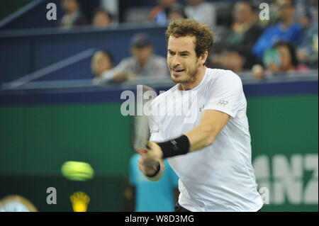 Andy Murray of Britain returns a shot to Tomas Berdych of Czech Republic in their quarter-final match of the men's singles during the 2015 Shanghai Ro Stock Photo