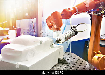 Industrial manipulator for making a plastic car model Stock Photo