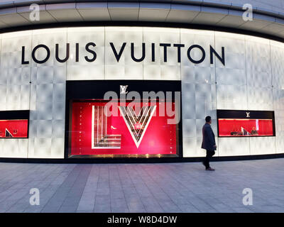 FILE--A pedestrian walks past a Louis Vuitton (LV) boutique of LVMH Moet Hennessy  Louis Vuitton SA in Fuzhou city, southeast Chinas Fujian province Stock  Photo - Alamy