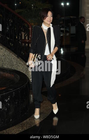 Hong Kong singer Sammi Cheng poses as she arrives for the wedding party of Hong Kong actor Kenny Bee and his wife Fan Jiang in Hong Kong, China, 22 Ma Stock Photo