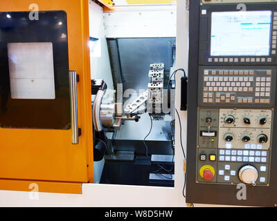 Compact modern lathe with CNC control panel Stock Photo