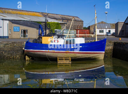 8 August 2019 The old working trawler Supreme undergoing routine painting and maintenance at the Quayside in Ardglass County Down Northern Ireland Stock Photo