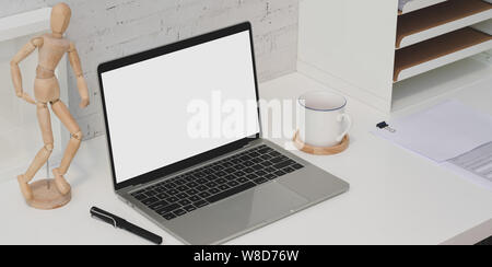 Trendy designer work place with open blank screen laptop with ...