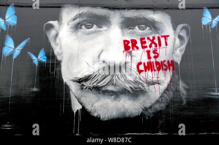 A painting in Rochester, Kent, celebrating local artist Billy Childish has been defaced with anti-Brexit graffiti. Stock Photo