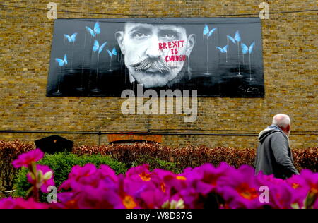 A painting in Rochester, Kent, celebrating local artist Billy Childish has been defaced with anti-Brexit graffiti. Stock Photo
