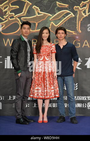 Chinese actress Ni Ni, center, and Taiwanese actor Mark Zhao, left, pose during a press conference for their new movie 'Warriors Gate' in Beijing, Chi Stock Photo