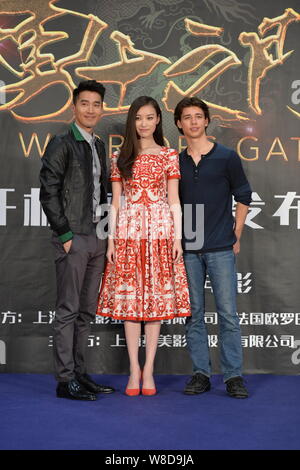 Chinese actress Ni Ni, center, and Taiwanese actor Mark Zhao, left, pose during a press conference for their new movie 'Warriors Gate' in Beijing, Chi Stock Photo