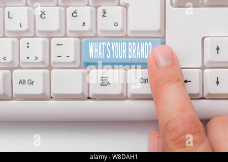 Writing note showing What S Your Brand Question. Business concept for asking about product logo does or what you communicate White pc keyboard with no Stock Photo
