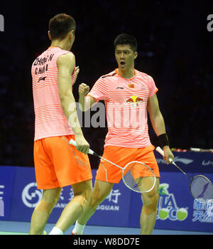 Fu Haifeng, right, and Zhang Nan of China celebrate after defeating Hiroyuki Endo and Kenichi Hayakawa of Japan in their final match during the 2015 S Stock Photo