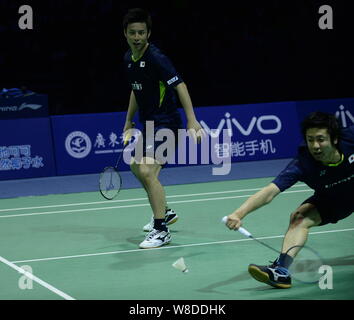 Hiroyuki Endo, right, and Kenichi Hayakawa of Japan compete against Fu Haifeng and Zhang Nan of China in their final match during the 2015 Sudirman Cu Stock Photo