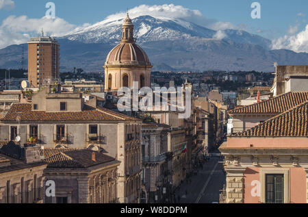 View on via Etnea in Catania. Dome of Catania and the main street with the background of volcano Etna, Sicily, Italy. Catania the UNESCO World Heritag Stock Photo