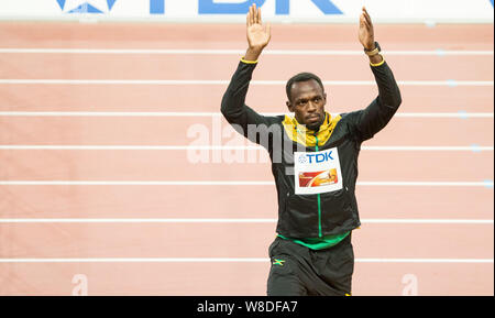 Jamaica's Usain Bolt celebrates to receive his gold medal on the podium after winning the men's 200m final during the Beijing 2015 IAAF World Champion Stock Photo