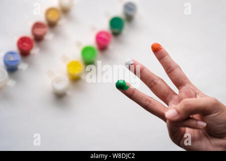 woman showing tricolor of Indian flag with her painted fingers. Independence day background concept. Stock Photo