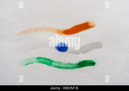 Close-up shot of Indian tricolor flag painted with water colors isolated on white background. Indian national flag concept. Stock Photo