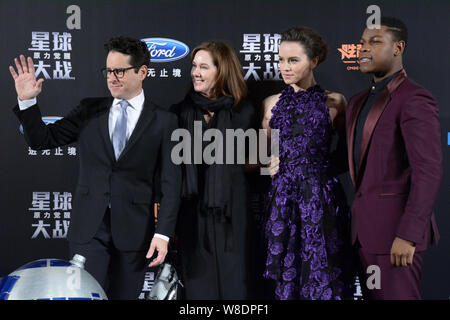 American director J. J. Abrams, left, English actress Daisy Ridley, second right, pose during a premiere for their movie 'Star Wars: The Force Awakens Stock Photo