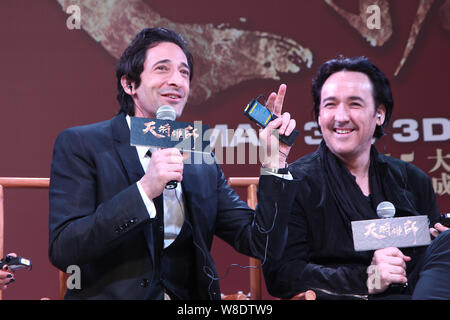 American actor Adrien Brody, left, speaks as John Cusack smiles during a premiere for their new movie 'Dragon Blade' in Shanghai, China, 6 February 20 Stock Photo