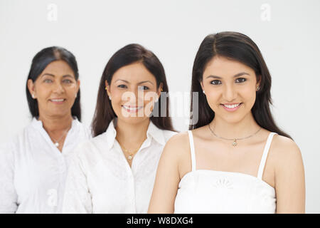 Three generation of women in a row Stock Photo