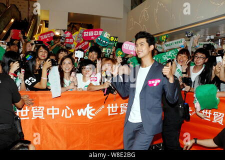 Singer and actor Ok Taec-yeon of South Korean boy group 2PM, right ...