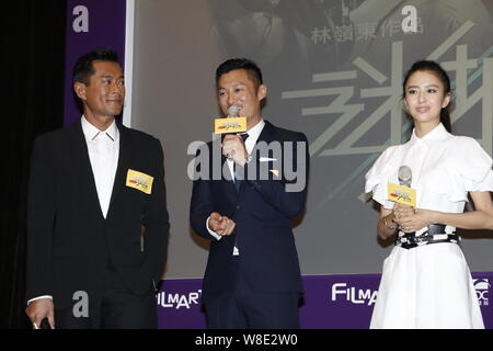 (From left) Hong Kong actors Louis Koo, Shawn Yue and  Chinese actress Tong Liya attend the premiere for their new movie 'Wild City' during the 39th H Stock Photo