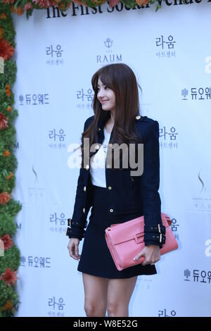 South Korean actress Han Chae-young poses as she arrives for the wedding of actress Lee So-yeon in Seoul, South Korea, 12 September 2015. Stock Photo