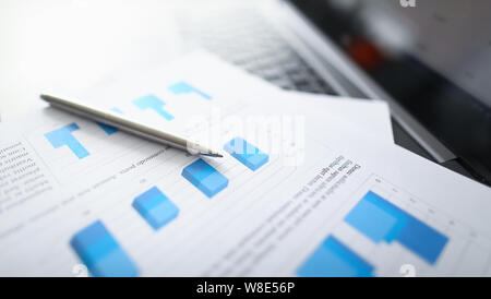 Silver pen lies on paper documents with color Stock Photo