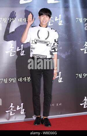 Hwang Kwang-hee (Kwanghee) of South Korean boy group ZE:A poses as he arrives for an VIP screening event of the new movie 'The Guest', also released a Stock Photo