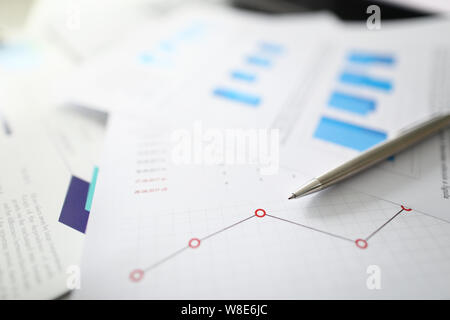 Silver pen lies on documents with Stock Photo
