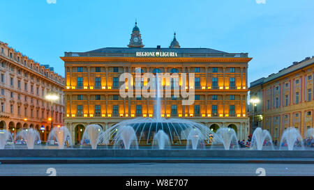 Genoa (Genova), Italy - June 30, 2019: Panoramic view of De Ferrari square with the fountain in Genoa in the evening Stock Photo